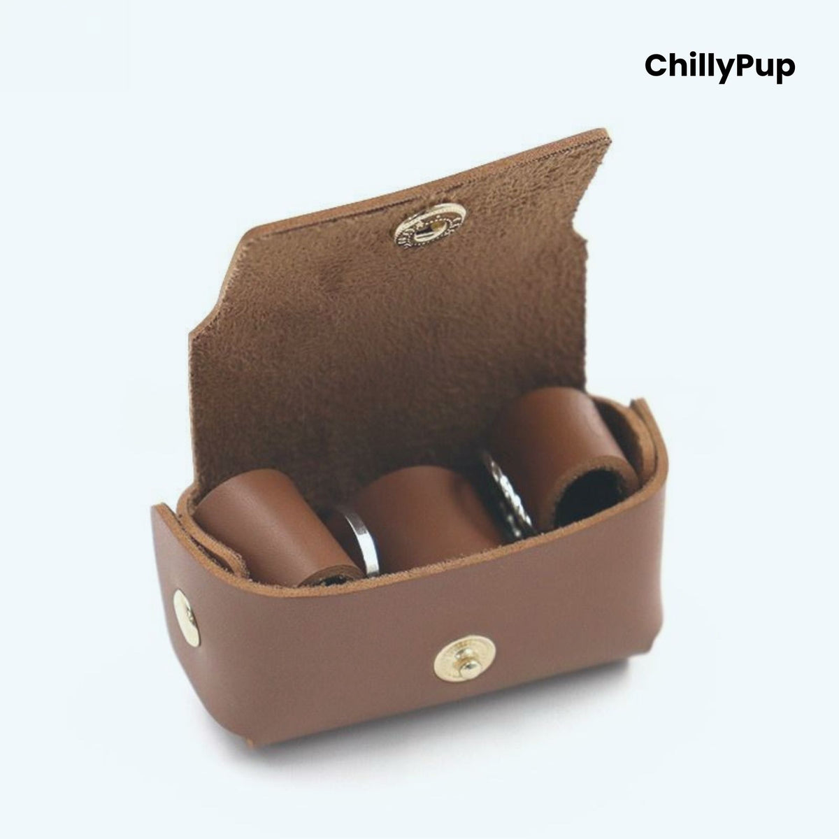 Brown leather ring case with three cylindrical items inside, branded 'ChillyPup'.