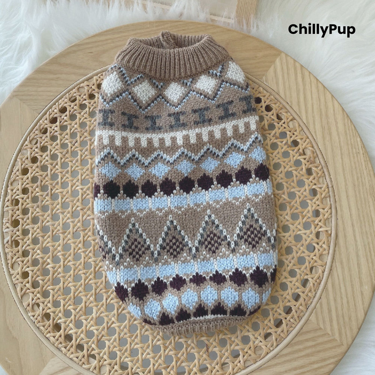 Patterned dog sweater on a wooden surface with 'ChillyPup' branding.
