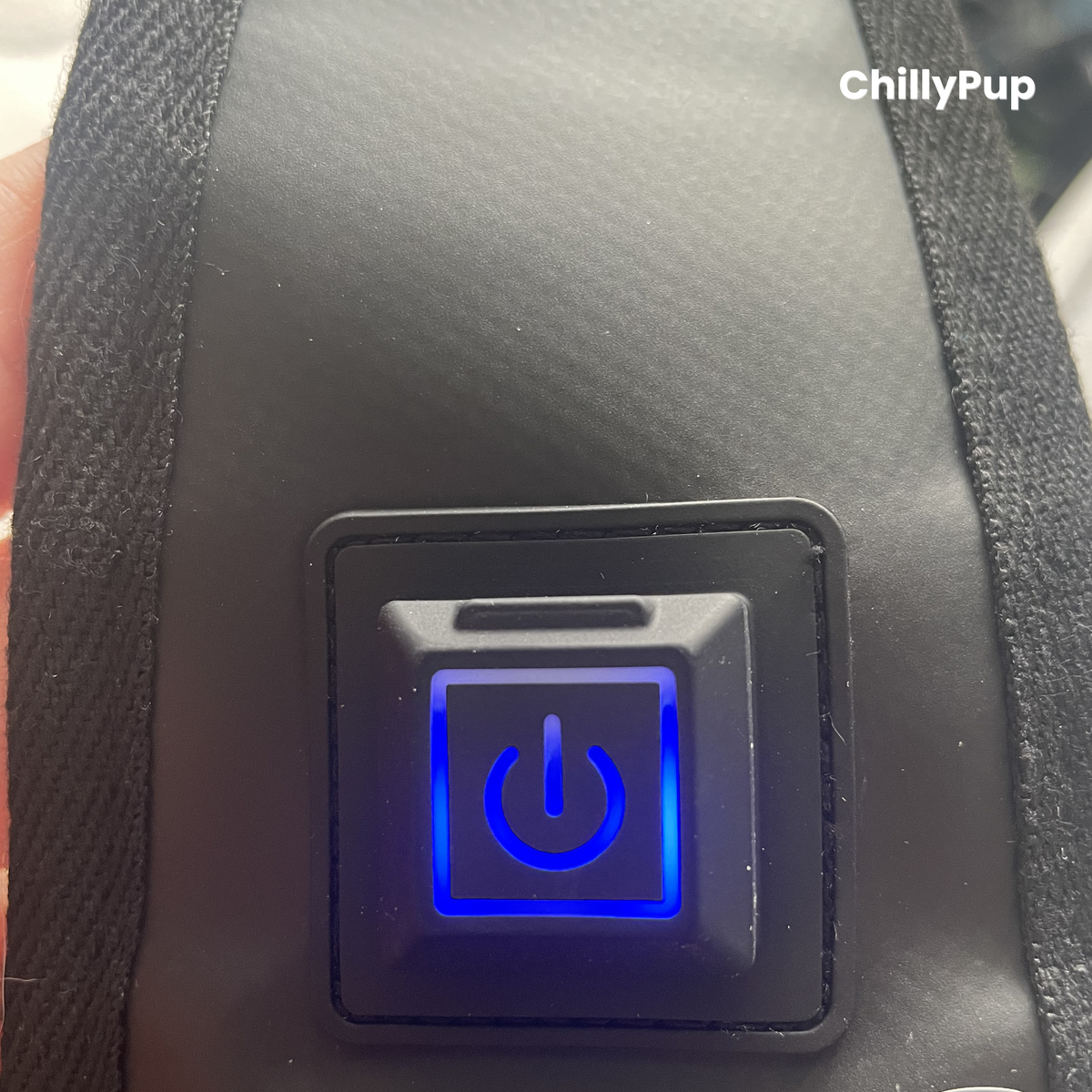 Power button with blue light on a black surface, branded 'ChillyPup'.