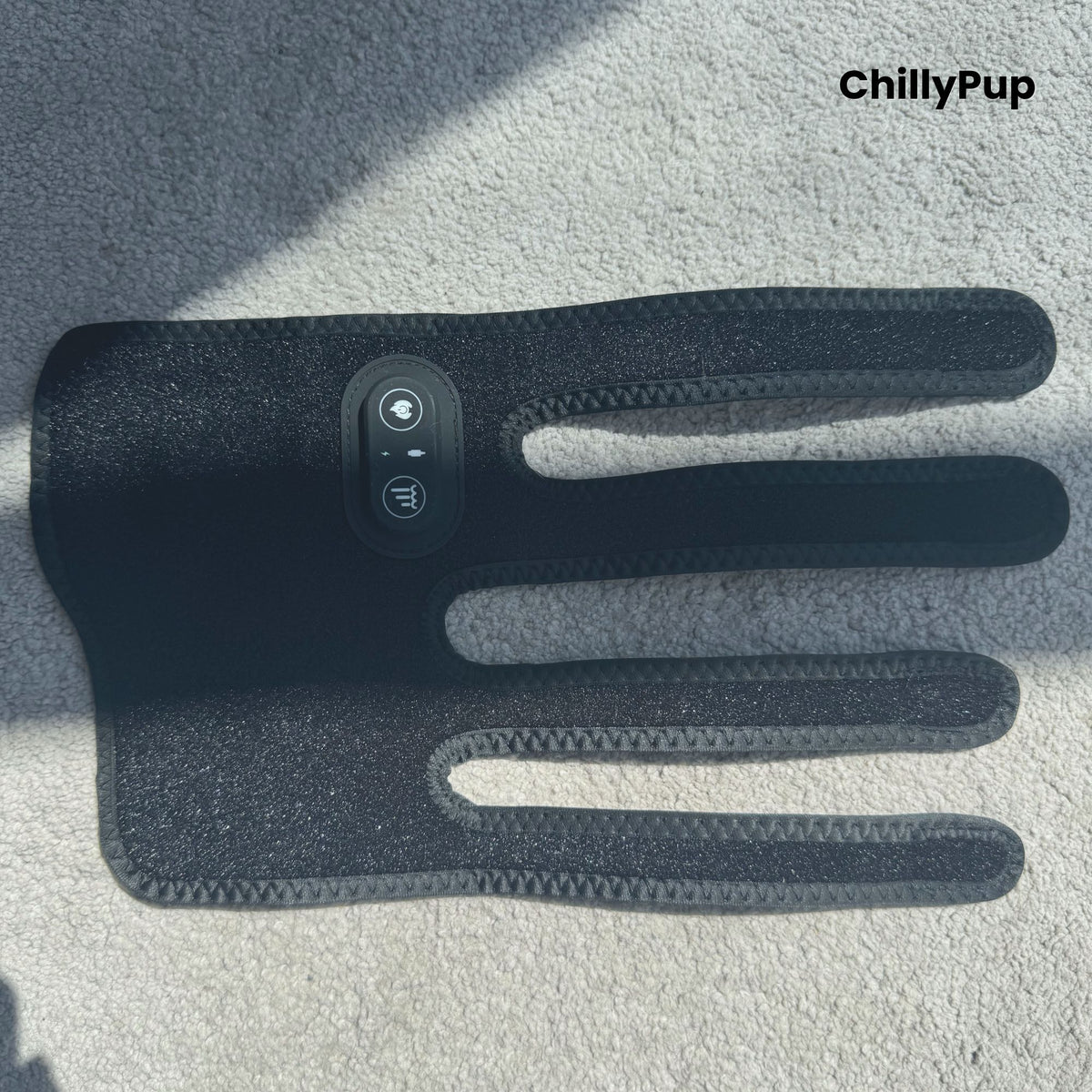 A black redlight leg wrap facing down on a carpet with ChillyPup branding.
