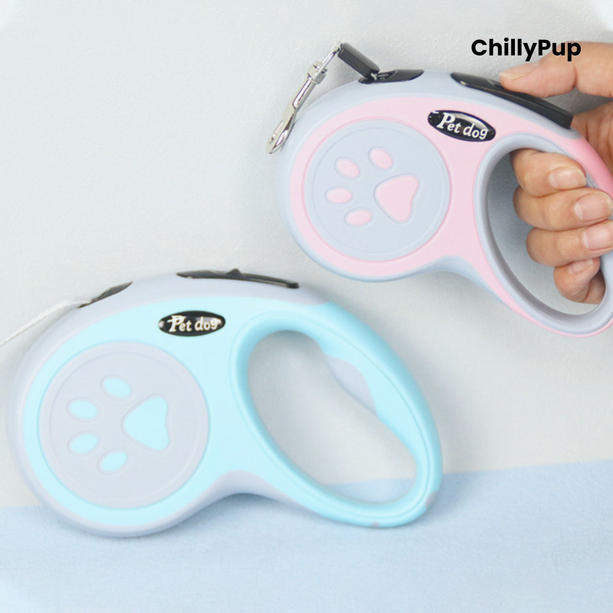Retractable dog Leads with pink and grey design featuring a paw print, branded 'ChillyPup'.